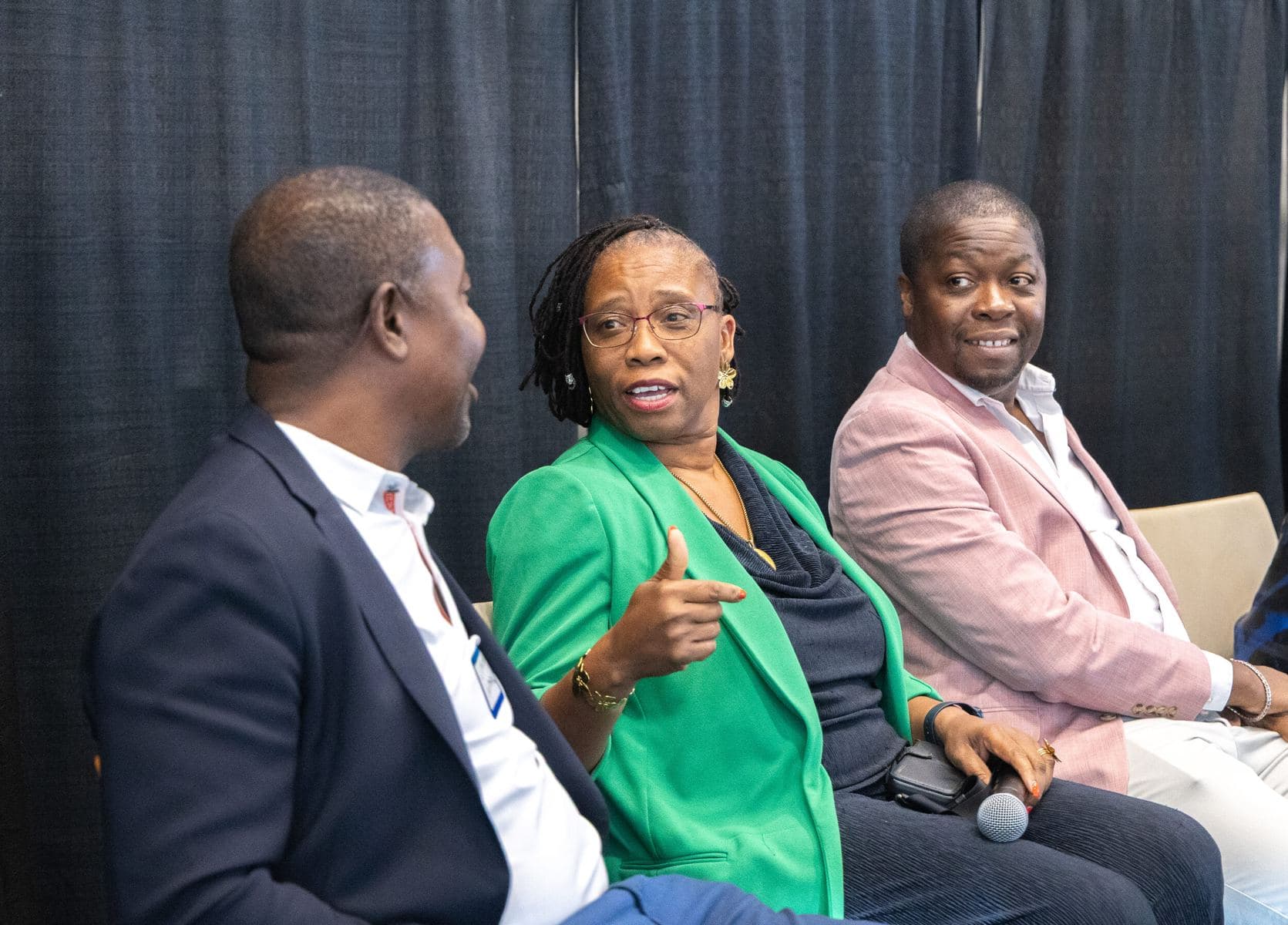 Panelists seated in conversation at the 2025 Forum