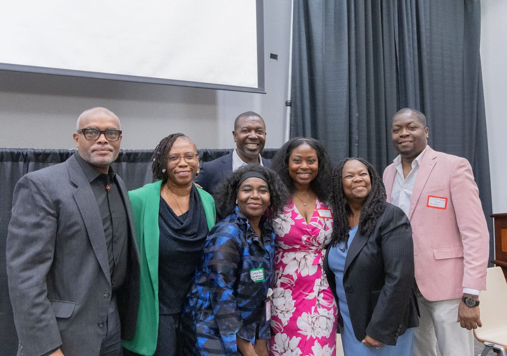 Speakers and organizers posing together at the 2025 Forum